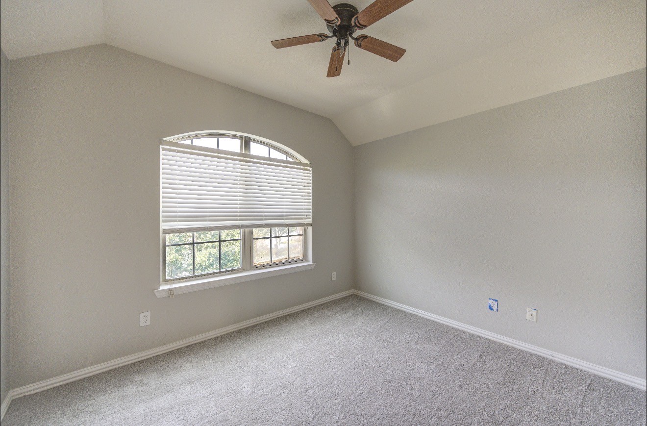 7 Maple Mill Court Conroe, TX 77301 - Photo 41 of 49 a view of an empty room with a window