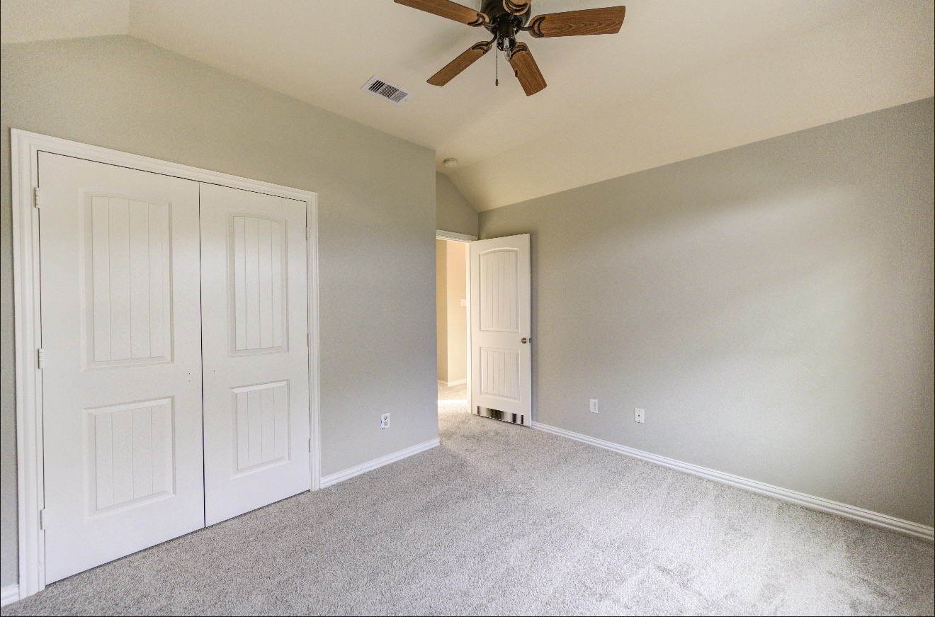 7 Maple Mill Court Conroe, TX 77301 - Photo 42 of 49 a view of a room with a ceiling fan
