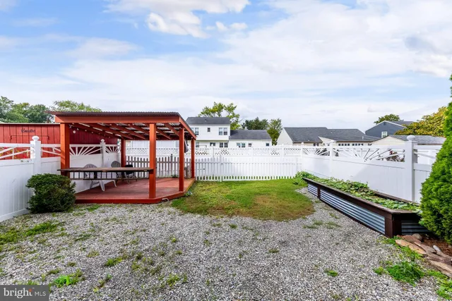 a view of a backyard with sitting area