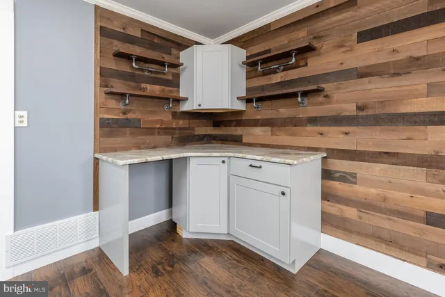 a kitchen with stainless steel appliances cabinets and a table