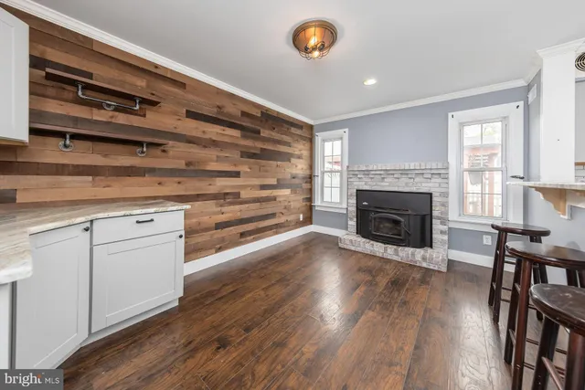 a view of a livingroom with furniture and a fireplace