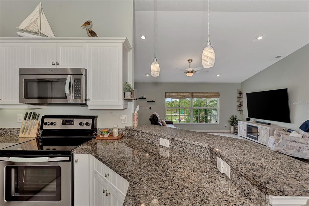 8 Amidship Road Placida, FL 33946 - Photo 13 of 47 a kitchen with a stove and a microwave