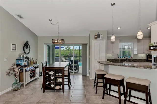a dining room with furniture and window