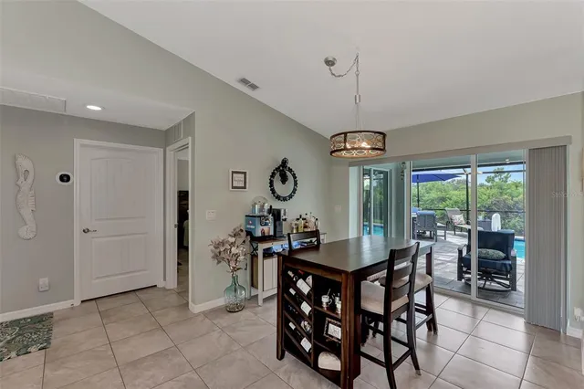 a view of a dining room with furniture window and outside view