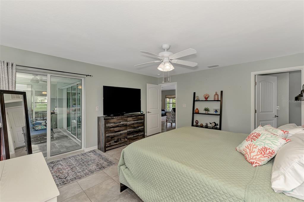 8 Amidship Road Placida, FL 33946 - Photo 19 of 47 a bedroom with a bed and a flat screen tv