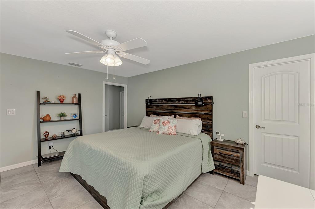 8 Amidship Road Placida, FL 33946 - Photo 20 of 47 a bedroom with a bed and a chandelier