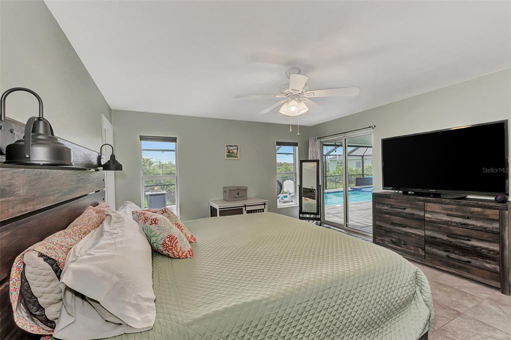 8 Amidship Road Placida, FL 33946 - Photo 22 of 47 a bedroom with a bed and a flat screen tv