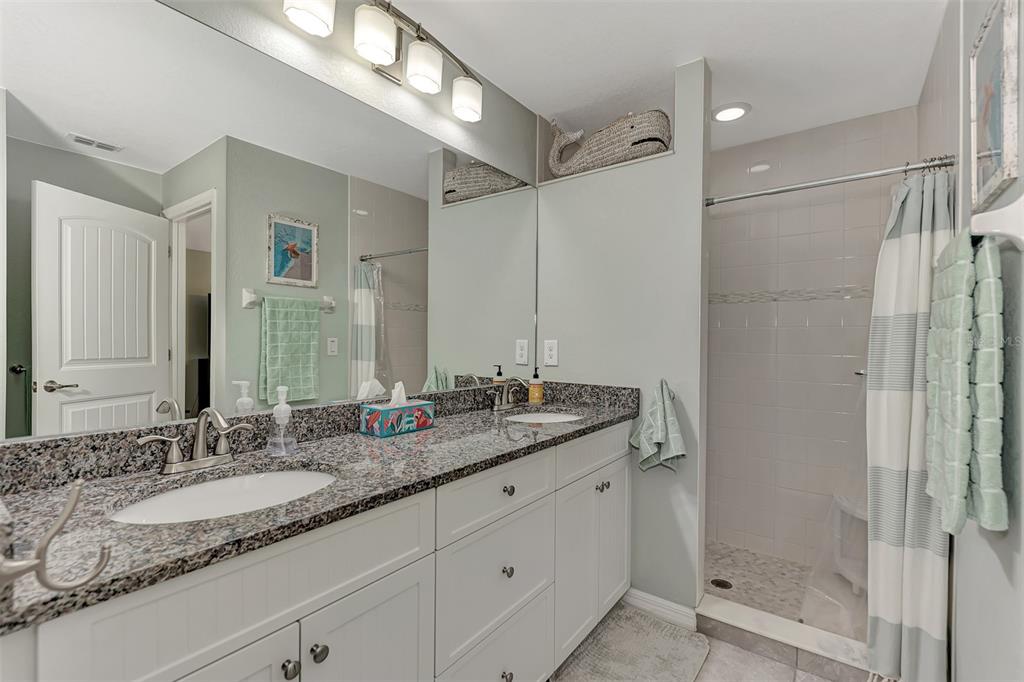 8 Amidship Road Placida, FL 33946 - Photo 23 of 47 a bathroom with a granite countertop sink mirror and double