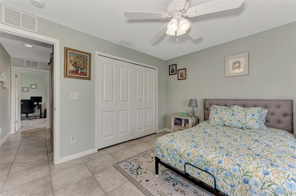 8 Amidship Road Placida, FL 33946 - Photo 25 of 47 a bedroom with a large bed and a chandelier