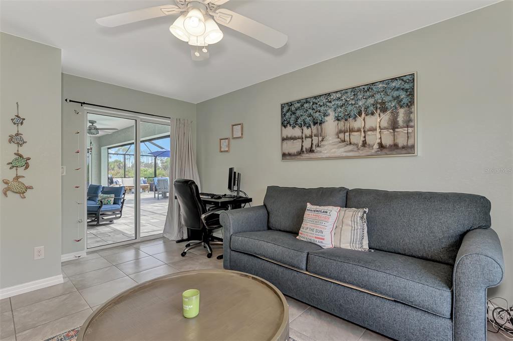 8 Amidship Road Placida, FL 33946 - Photo 27 of 47 a living room with furniture and a chandelier