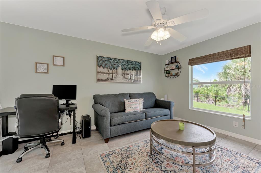 8 Amidship Road Placida, FL 33946 - Photo 28 of 47 a living room with furniture a window and a flat screen tv