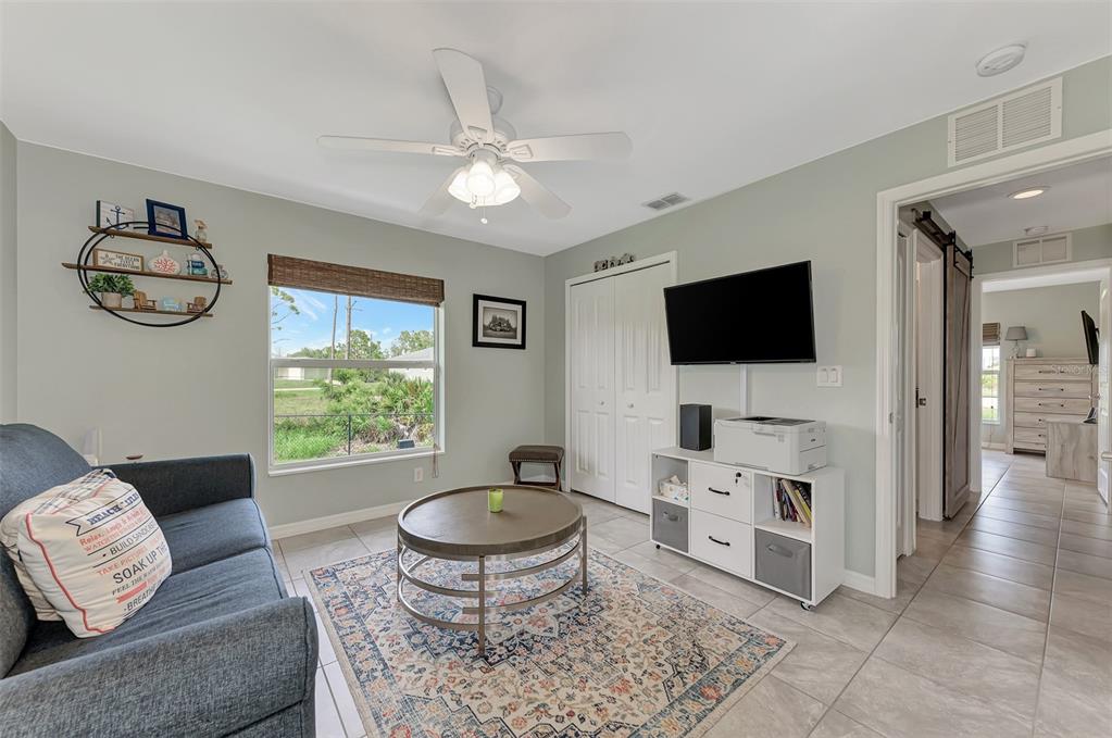8 Amidship Road Placida, FL 33946 - Photo 29 of 47 a living room with furniture and a flat screen tv