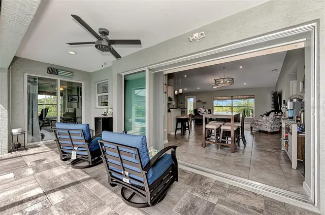 a view of a patio with a dining table and chairs