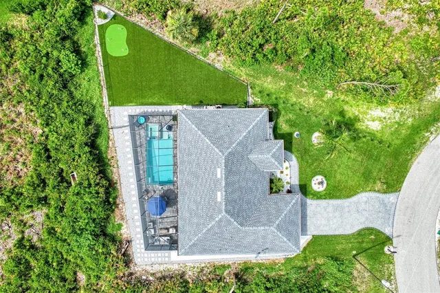 an aerial view of a house with a garden