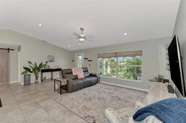 a living room with furniture and a flat screen tv