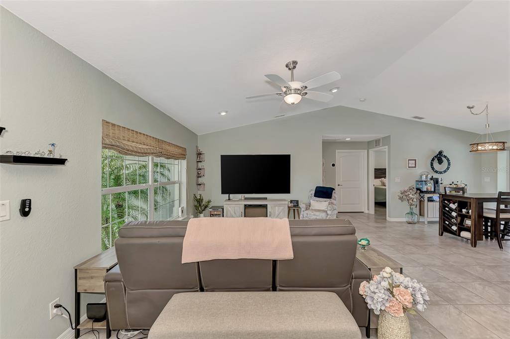 8 Amidship Road Placida, FL 33946 - Photo 7 of 47 a living room with furniture a large window and a flat screen tv