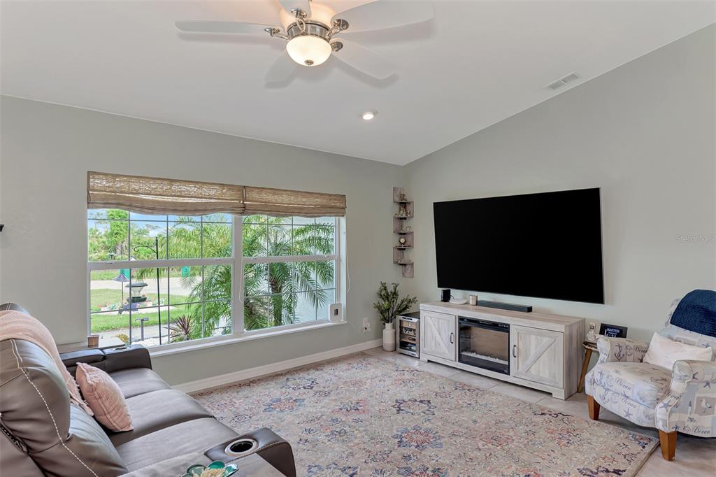 8 Amidship Road Placida, FL 33946 - Photo 8 of 47 a living room with furniture and a flat screen tv