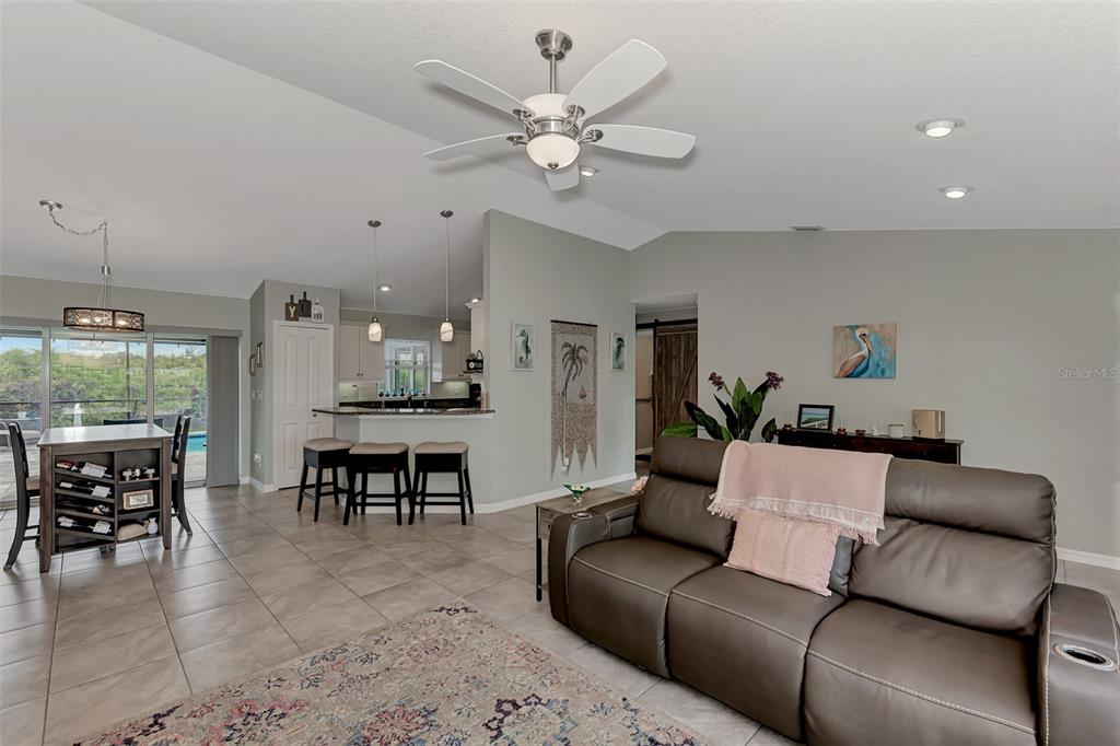 8 Amidship Road Placida, FL 33946 - Photo 9 of 47 a living room with furniture kitchen view and a chandelier