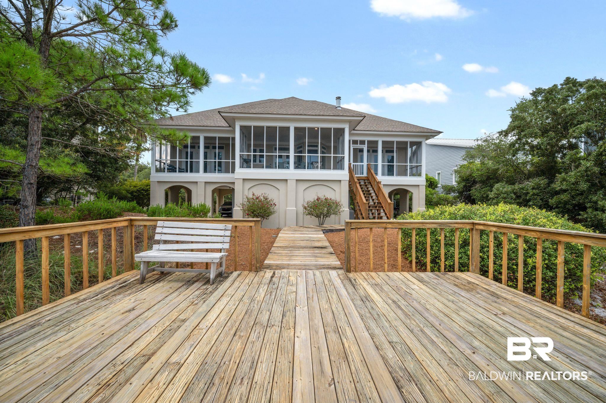 31800 River Road Orange Beach, AL 36561 - Photo 58 of 69 Wooden terrace featuring a sunroom