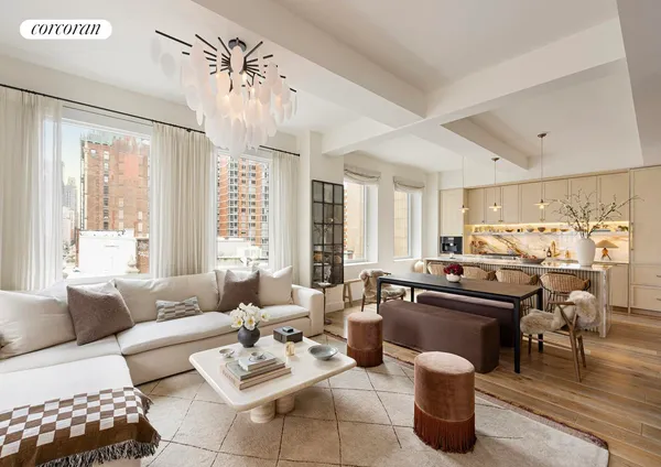a living room with furniture kitchen view and a large window