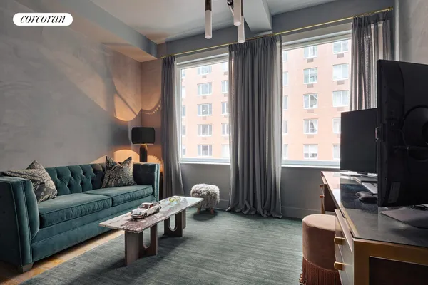 a living room with furniture and a window
