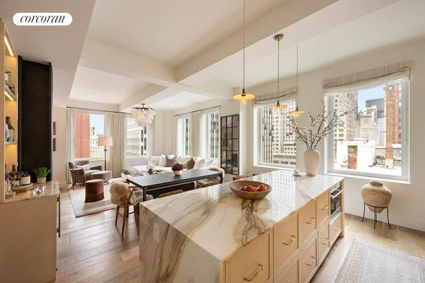 a kitchen with sink a faucet and cabinets