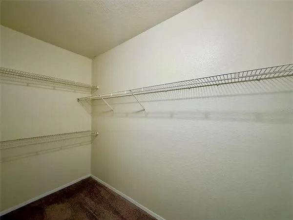 a view of a room with racks on the wall
