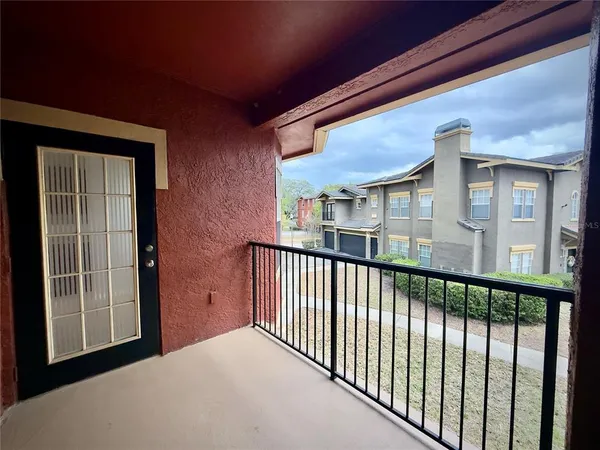 a view of a swimming pool and a chairs