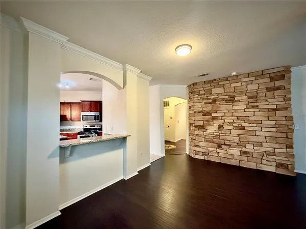 a view of kitchen with sink and wooden floor