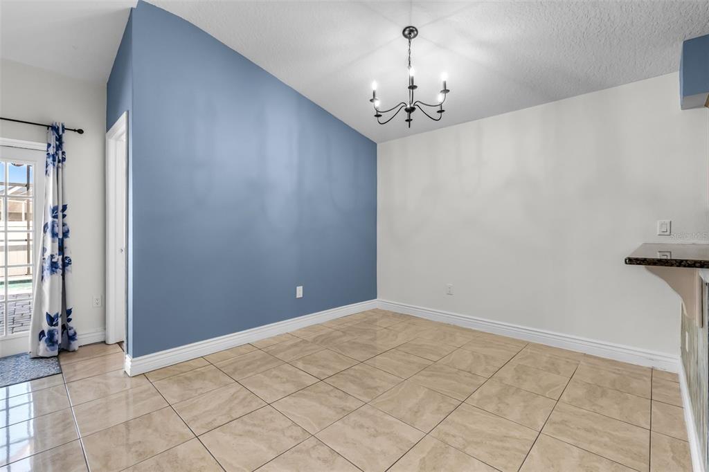 1424 Ocean Reef Road Wesley Chapel, FL 33544 - Photo 11 of 47 a view of a chandelier in big room and chandelier