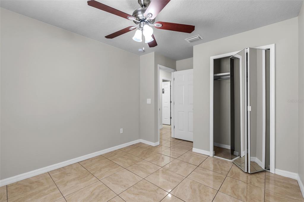 1424 Ocean Reef Road Wesley Chapel, FL 33544 - Photo 17 of 47 wooden floor in an empty room