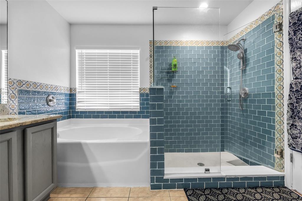1424 Ocean Reef Road Wesley Chapel, FL 33544 - Photo 27 of 47 a bathroom with a bathtub and a shower