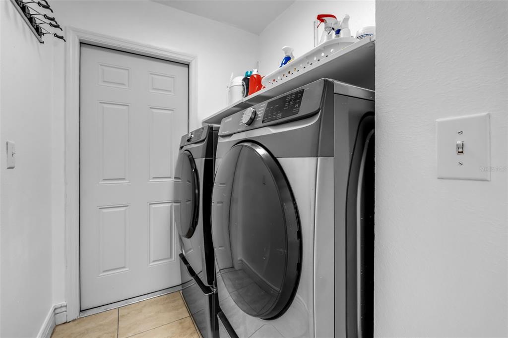 1424 Ocean Reef Road Wesley Chapel, FL 33544 - Photo 30 of 47 a utility room with dryer and washer