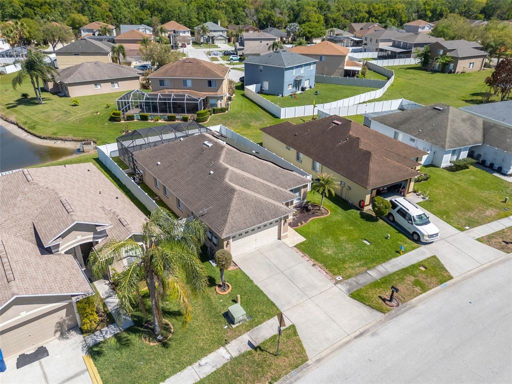 1424 Ocean Reef Road Wesley Chapel, FL 33544 - Photo 37 of 47 an aerial view of a houses with a garden