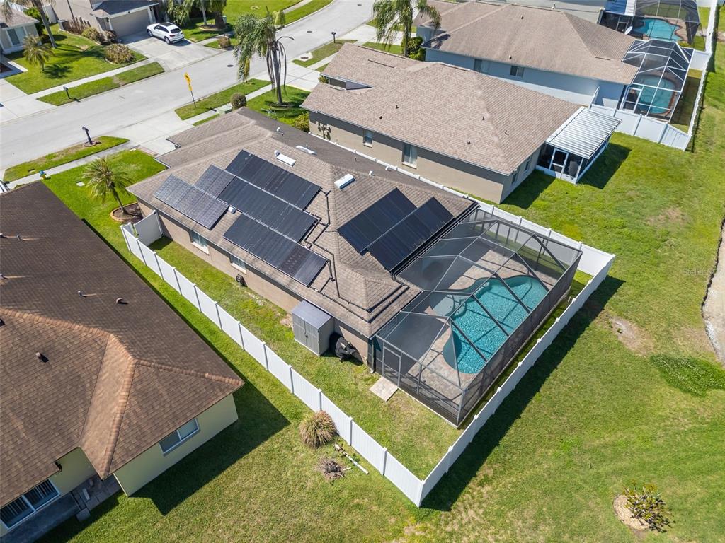 1424 Ocean Reef Road Wesley Chapel, FL 33544 - Photo 39 of 47 an aerial view of a residential houses with yard