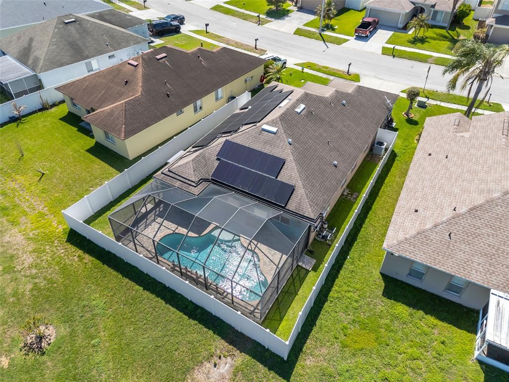 1424 Ocean Reef Road Wesley Chapel, FL 33544 - Photo 40 of 47 swimming pool with a yard