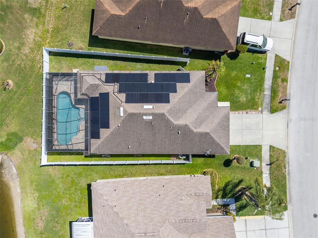 1424 Ocean Reef Road Wesley Chapel, FL 33544 - Photo 42 of 47 an aerial view of a house with a garden and a yard
