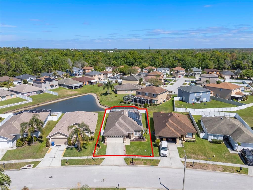 1424 Ocean Reef Road Wesley Chapel, FL 33544 - Photo 43 of 47 a view of multiple houses with outdoor space