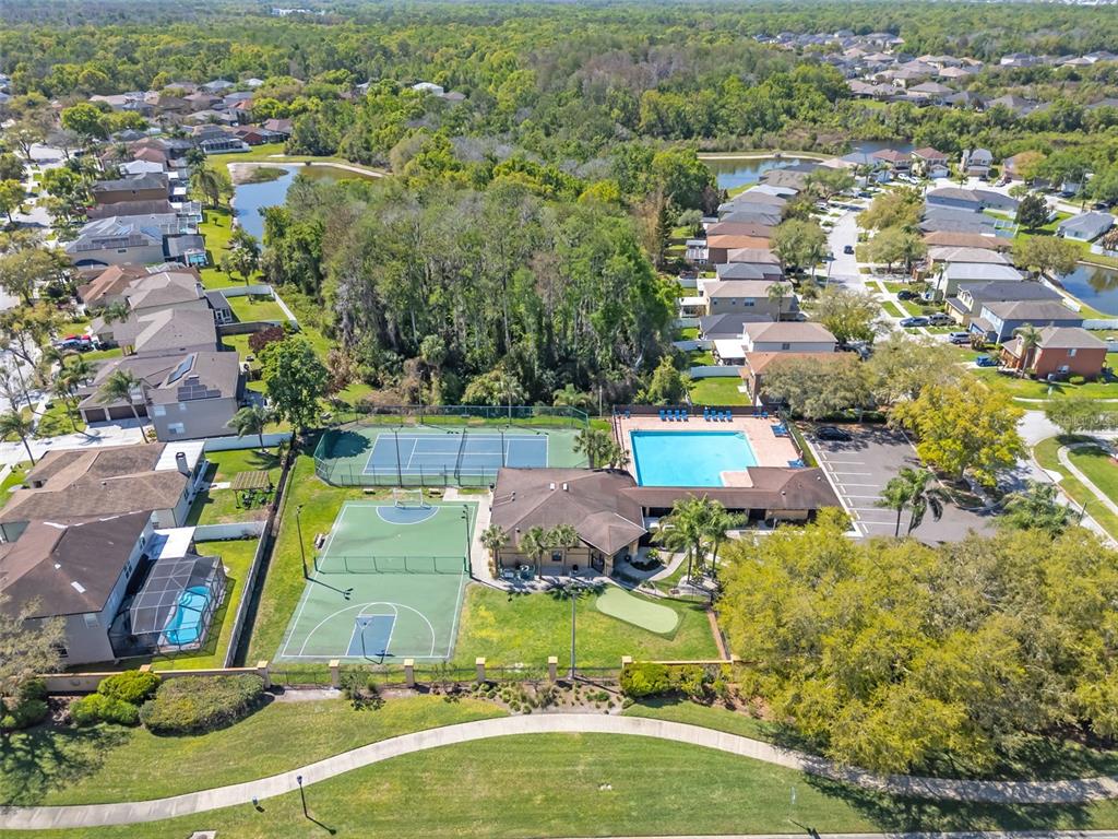 1424 Ocean Reef Road Wesley Chapel, FL 33544 - Photo 45 of 47 an aerial view of residential houses with outdoor space
