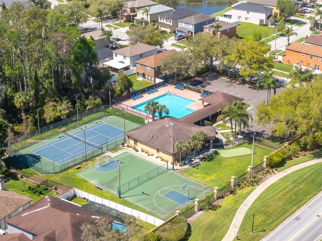 1424 Ocean Reef Road Wesley Chapel, FL 33544 - Photo 46 of 47 an aerial view of a pool patio swimming pool and outdoor seating