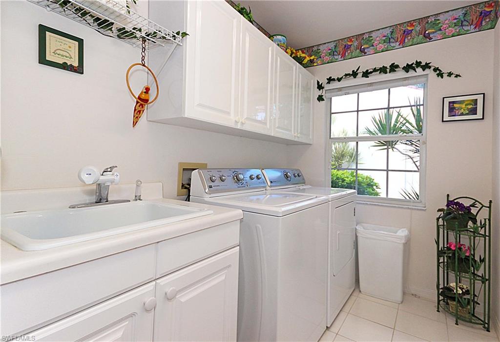 322 Melrose Place, Unit 31 Naples, FL 34104 - Photo 12 of 18 a utility room with dryer and washer