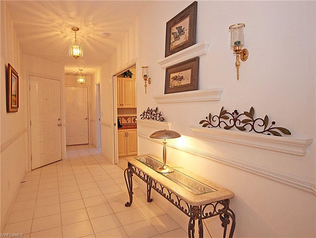 322 Melrose Place, Unit 31 Naples, FL 34104 - Photo 6 of 18 a bathroom with a sink and a mirror