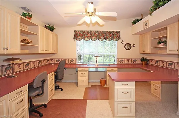 a room with a table chairs and a view of living room