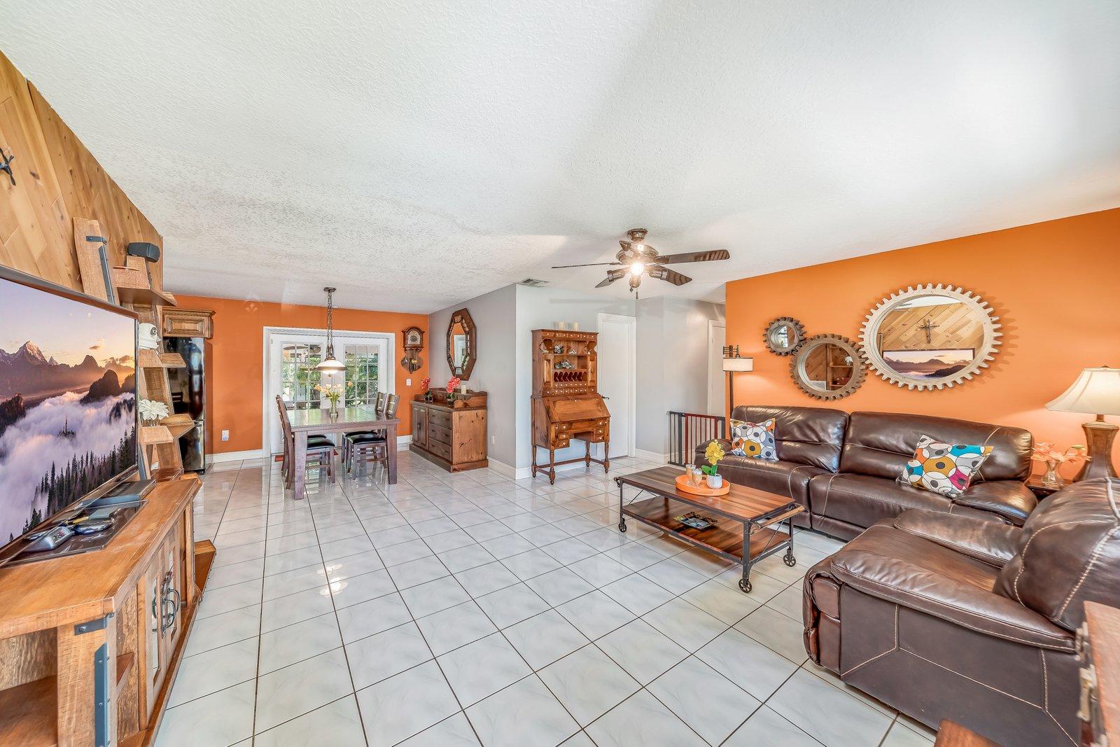 22206 Aquila Street Boca Raton, FL 33428 - Photo 14 of 73 a living room with furniture and a flat screen tv