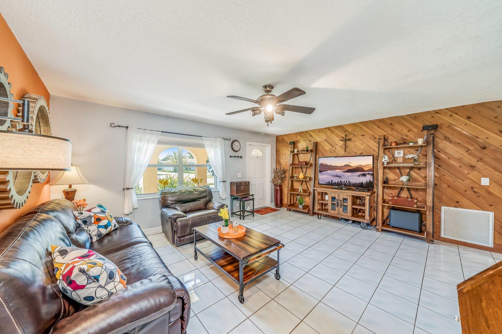 22206 Aquila Street Boca Raton, FL 33428 - Photo 15 of 73 a living room with furniture and a flat screen tv