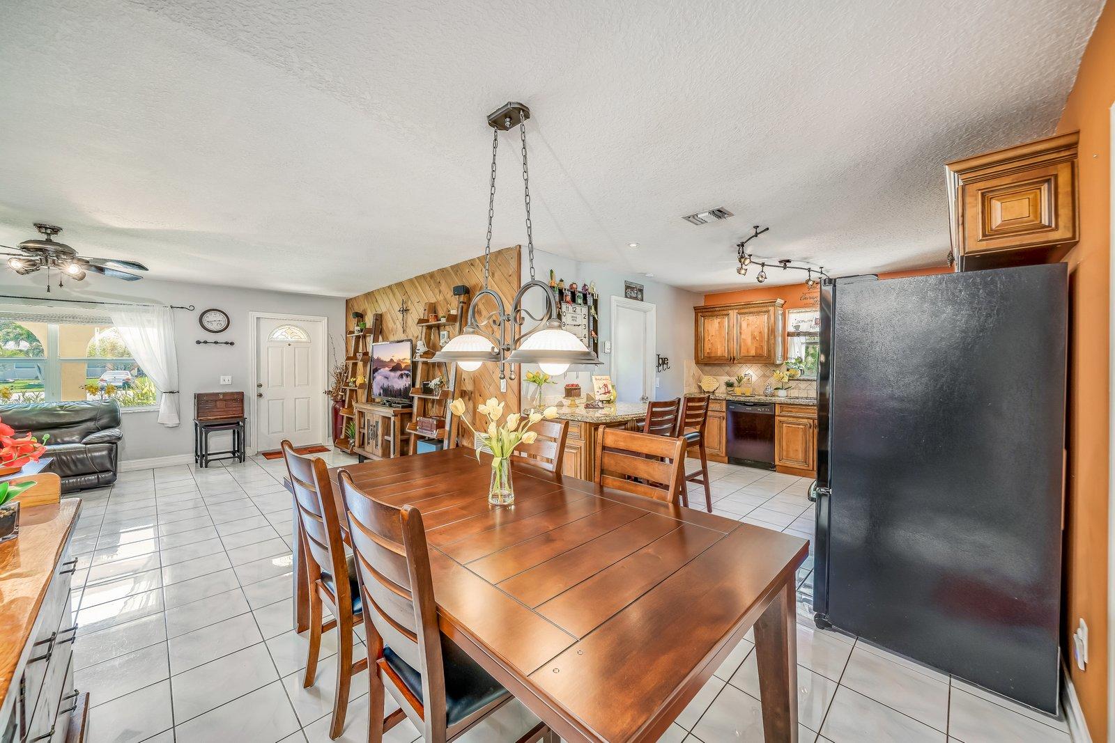 22206 Aquila Street Boca Raton, FL 33428 - Photo 19 of 73 a dining room with furniture and wooden floor