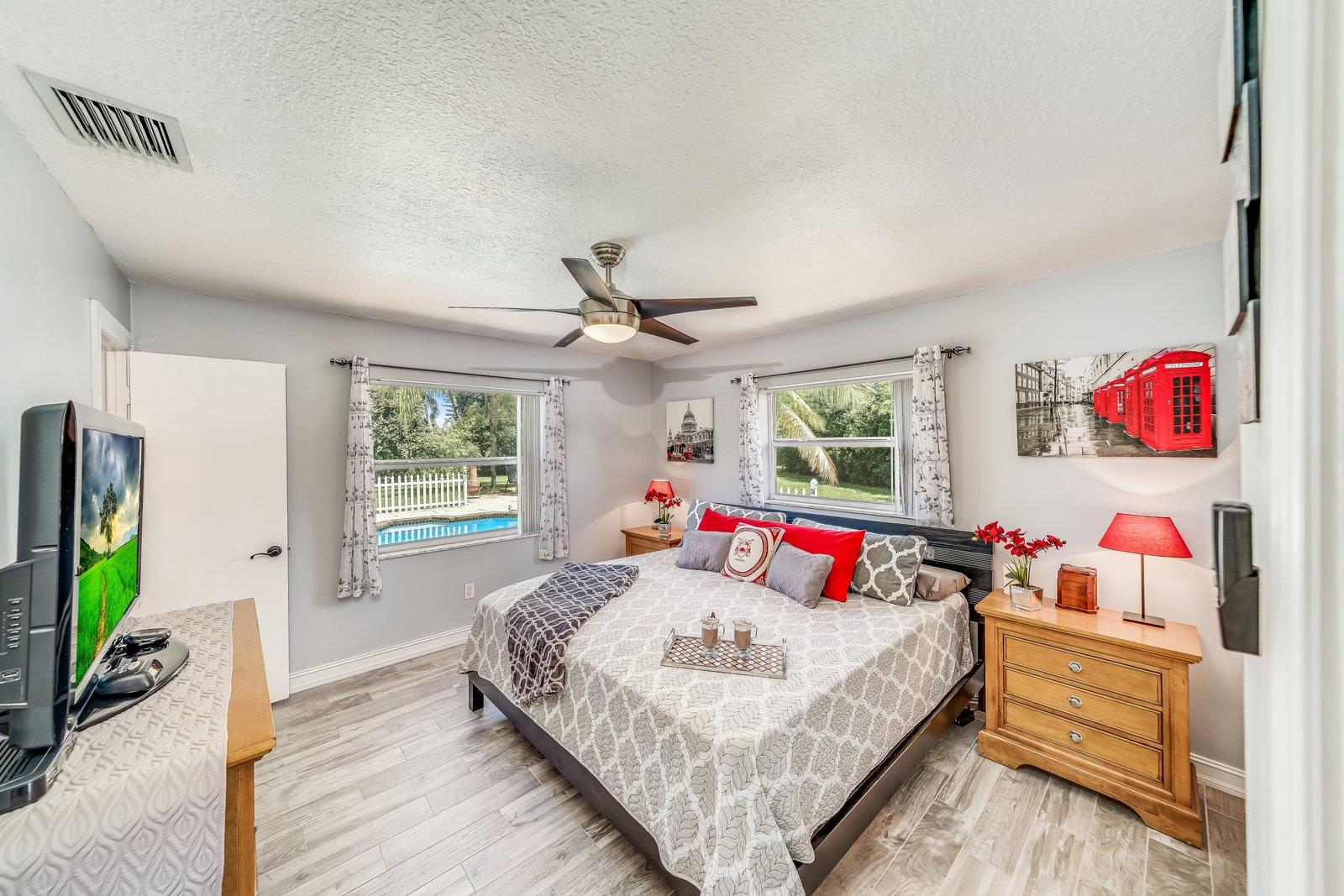 22206 Aquila Street Boca Raton, FL 33428 - Photo 29 of 73 a bedroom with a bed dresser and a window