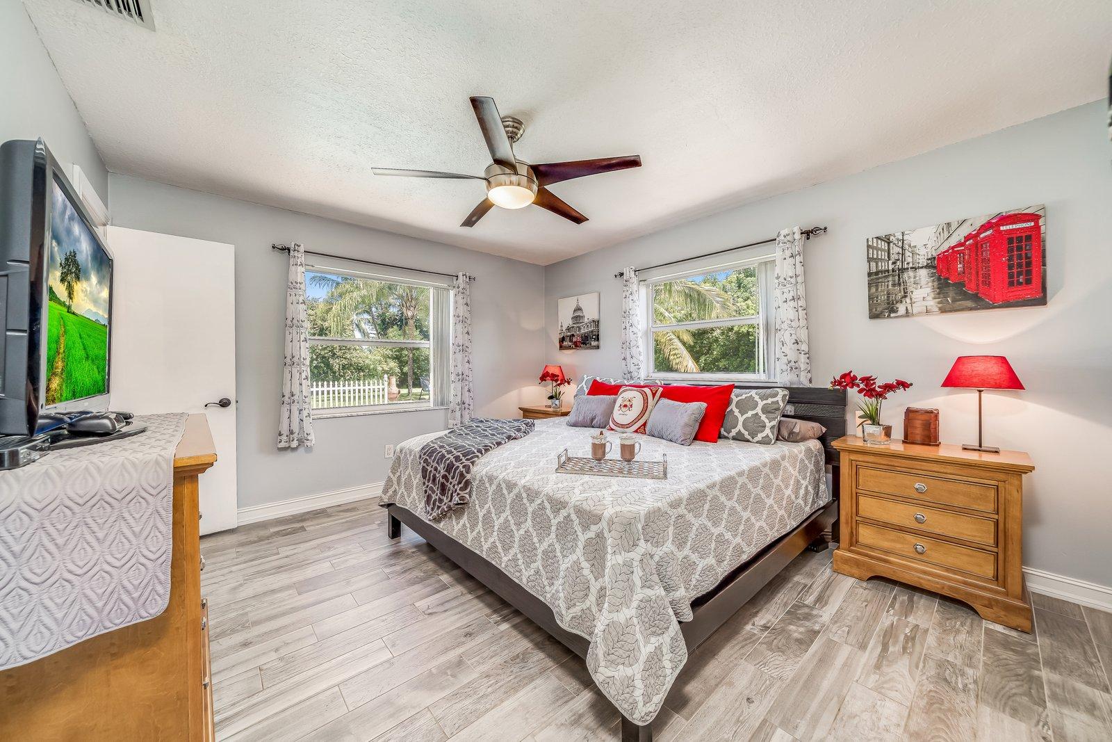 22206 Aquila Street Boca Raton, FL 33428 - Photo 30 of 73 a bedroom with a bed and a flat screen tv