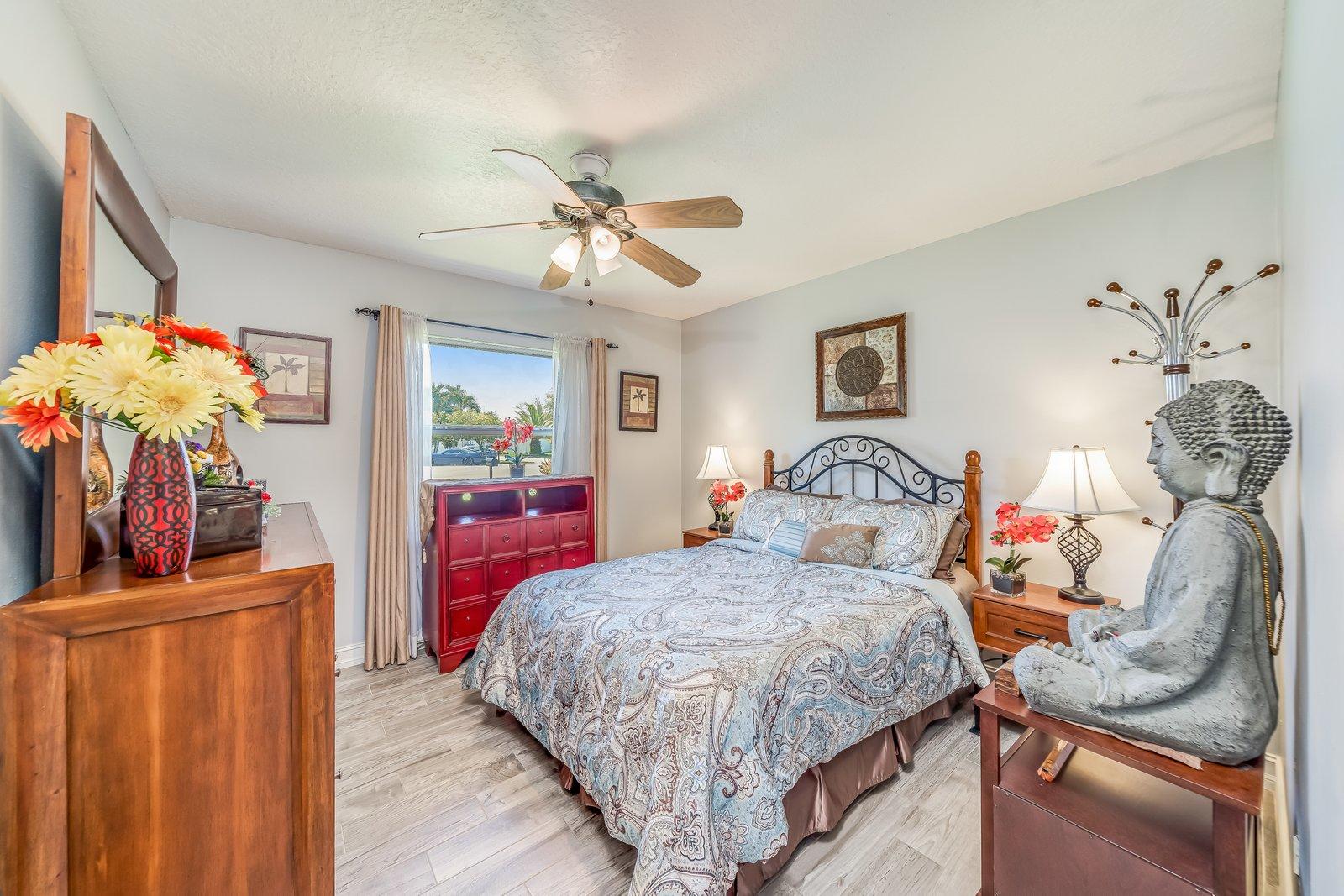 22206 Aquila Street Boca Raton, FL 33428 - Photo 35 of 73 a bedroom with a bed and a mirror