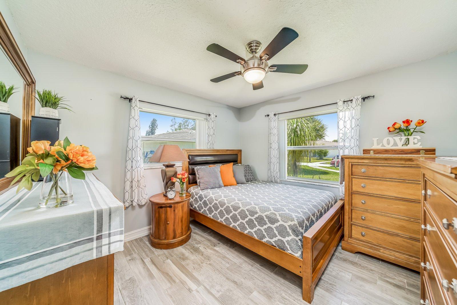 22206 Aquila Street Boca Raton, FL 33428 - Photo 38 of 73 a bedroom with a bed and a dresser